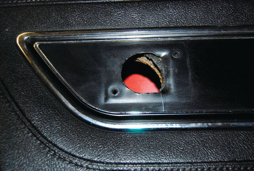 Someone cut this hole in the door panel for some unknown reason. Since a new door panel kit is $1000 and not in the budget, Heidi is looking for ways to patch this up. She was thinking of using a rapid setting polyester (RSP) product.